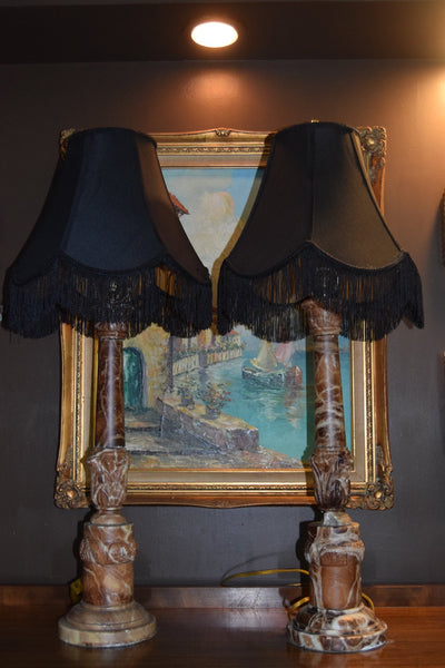 Pair of Carved Red Marble Column Lamps with Black Fringe Shades (Early 20th C.) - Loft of Echoes